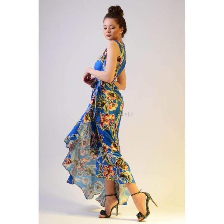 Side view of the long Chiara 2 wrap dress with a blue floral print and asymmetric hem