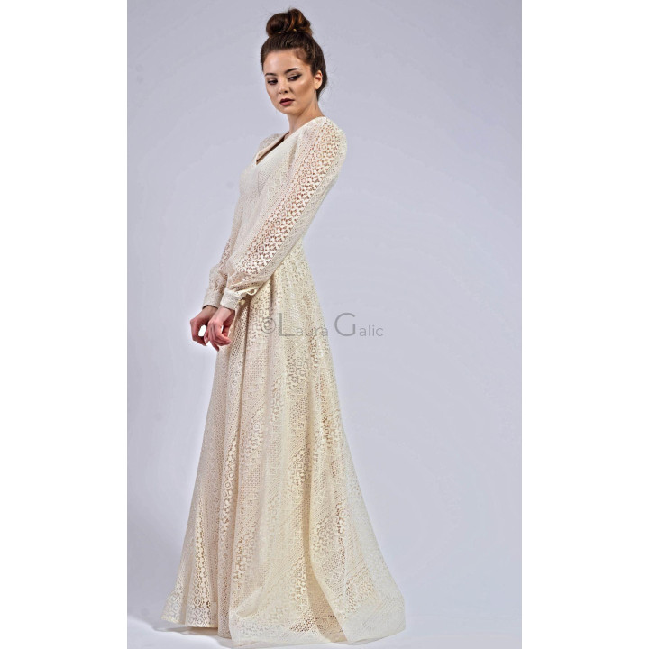 Side view of the Antonia 3 dress with a long lace sleeve and defined waist