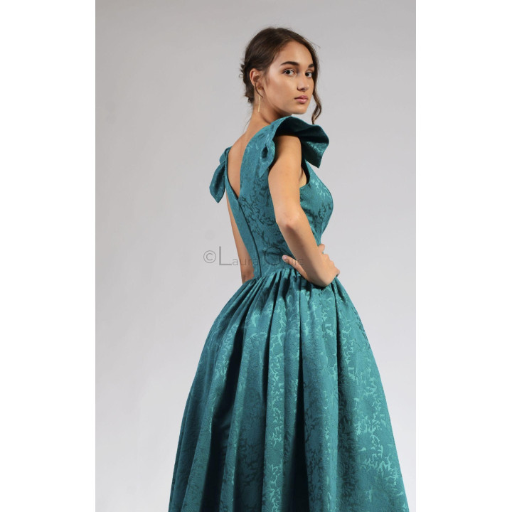 Detail of the low-cut back and gathered skirt of the teal Lidia brocade dress
