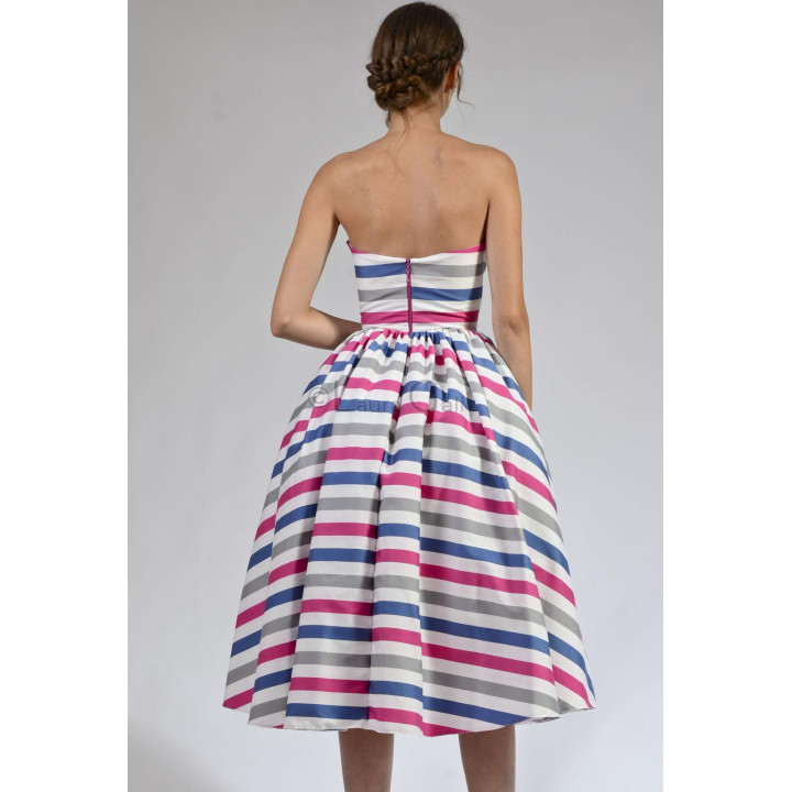 Back view of the Loredana 1 dress showing the corset zip and full striped skirt