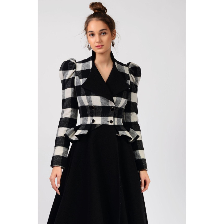 Close front detail of the Enia 2 coat’s checked bodice, black lapels and double buttons