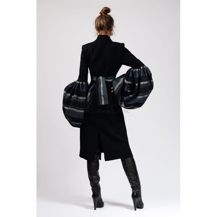 Back view of the Catinca coat with the organza apron tied at the waist