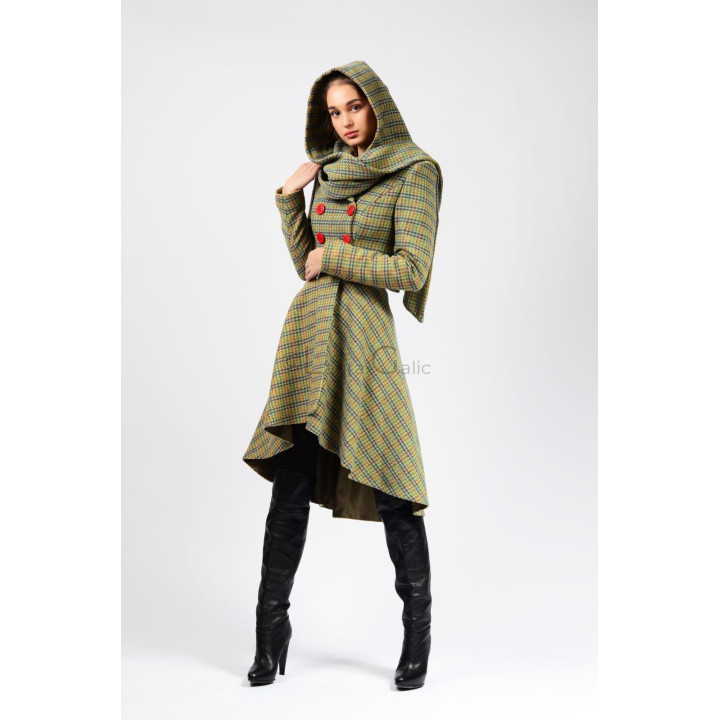 Full-length view of the hooded Miranda 3 coat with an asymmetric hem, styled with black boots