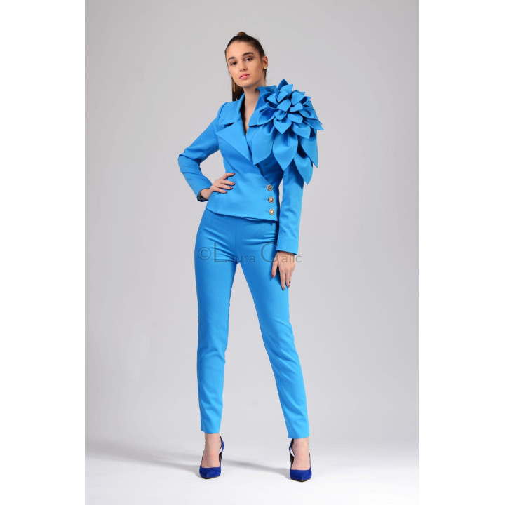 Delia suit showing the fitted jacket, asymmetric buttons and matching trousers