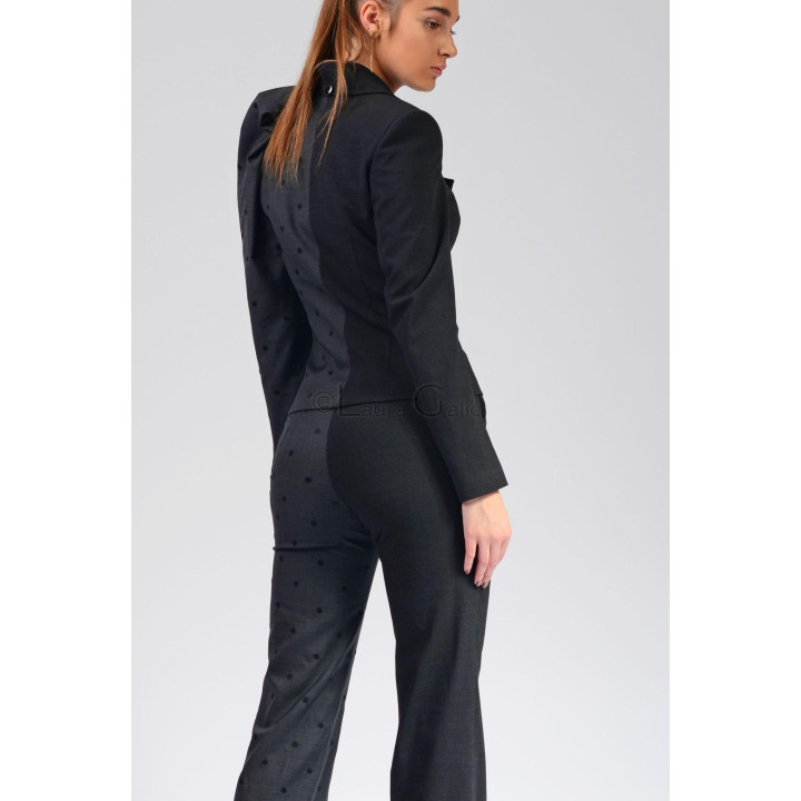 Back view of the Melinda 2 suit showing the polka-dot grey panels on the jacket and trousers