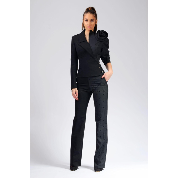Front view of the Melinda 2 suit with asymmetric lapel, shoulder flower and straight-leg trousers