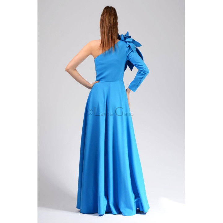 Back view of the Diedra dress showing its defined waist, full skirt and single long sleeve