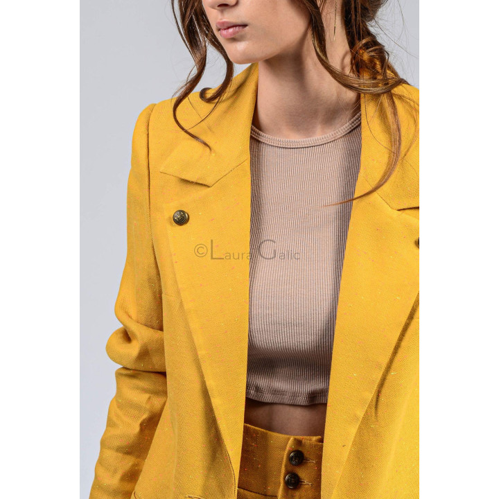 Close-up of the lapel and buttons on the yellow Ramona blazer
