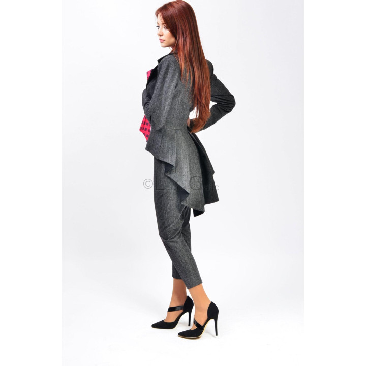 Women's Mina suit in charcoal grey, shown from the back with asymmetric jacket extensions and tapered trousers