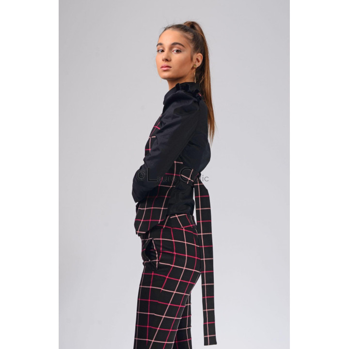 Side view of the black and pink plaid vest with a long back tie