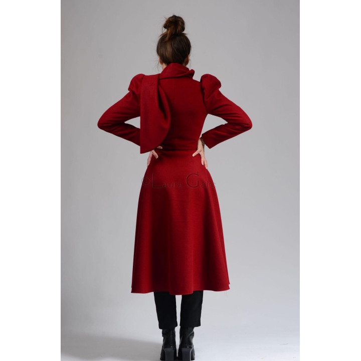 Back view of the red Beatrice 3 coat with puff shoulders and a full skirt