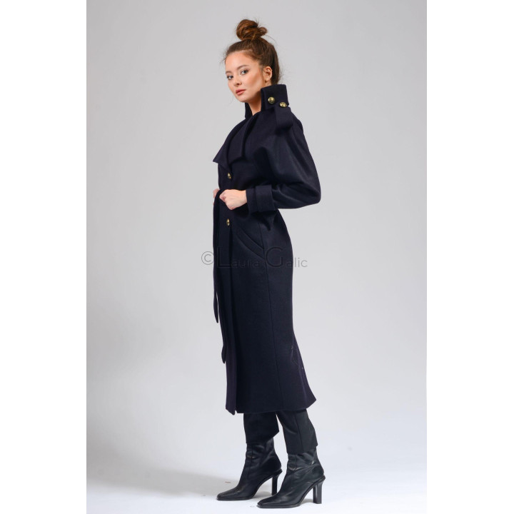 Side view of the Tudora coat showing its belted waist and buttoned high collar