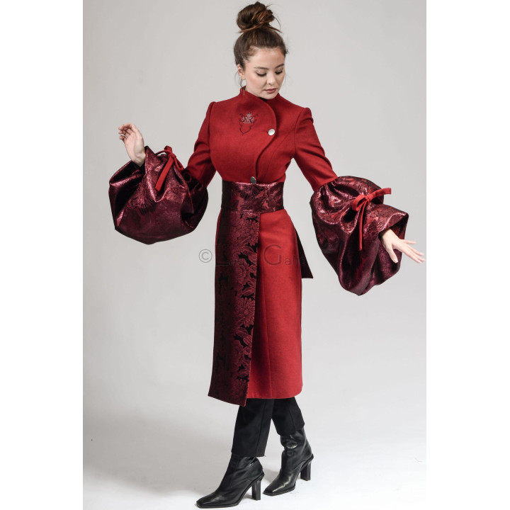 Red Catinca wool coat with voluminous organza sleeves and detachable floral apron