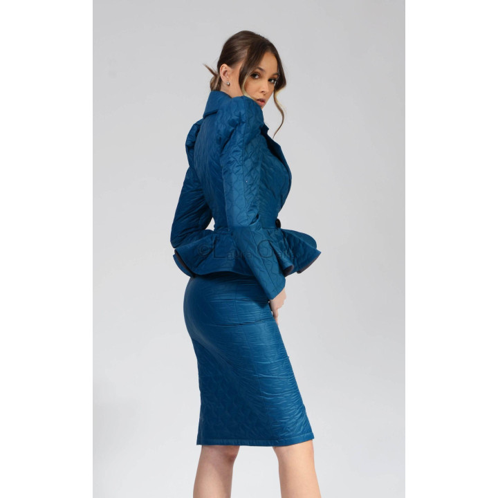 Back view of the Carmen 2 quilted turquoise suit showing the flared peplum and pencil skirt