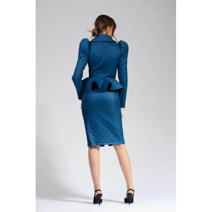 Rear view of the quilted Carmen 2 turquoise jacket and matching skirt