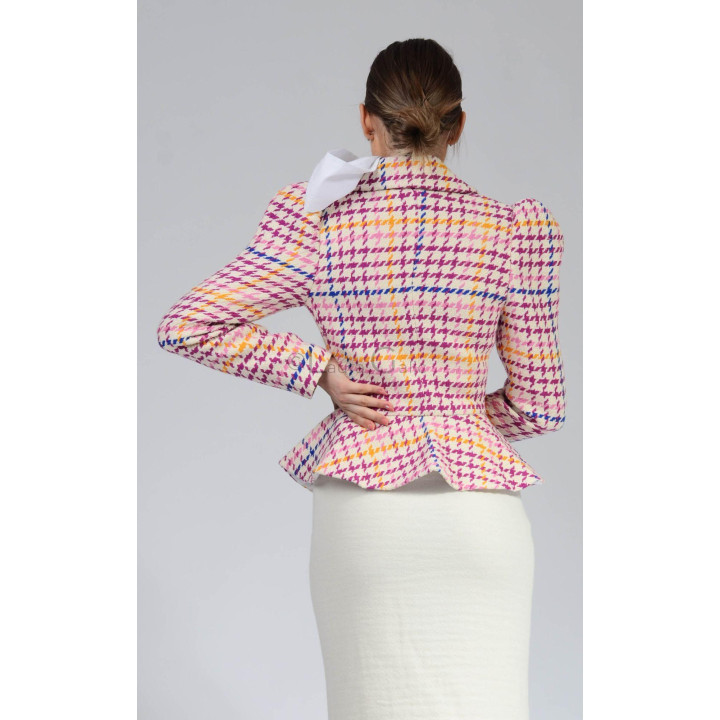 Back view of the Carmen 4 jacket showing its patterned fabric and flared peplum
