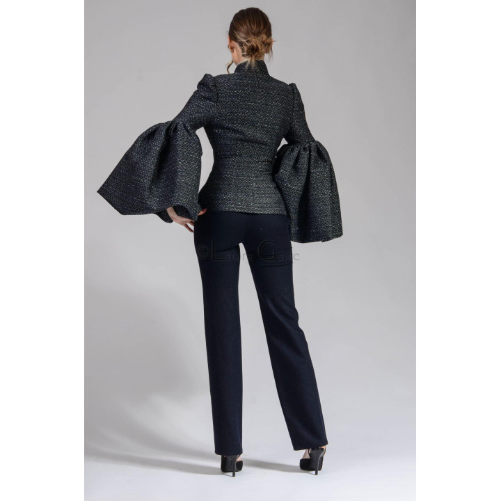 Back view of the Freia 2 jacket with a fitted waist and oversized sleeves