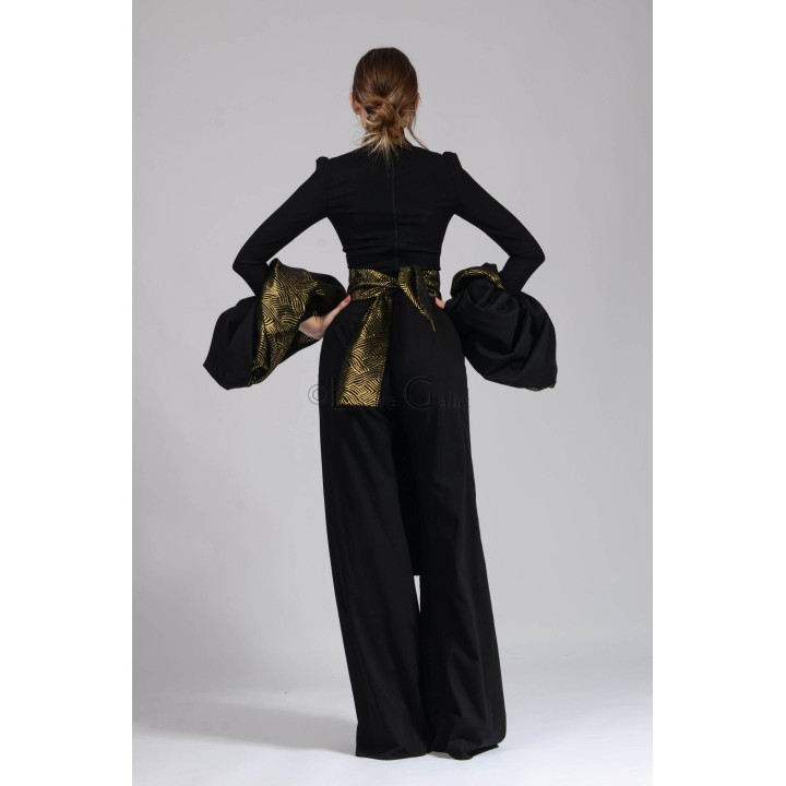 Back view of the Catinca ensemble showing the blouse zipper and brocade apron ties