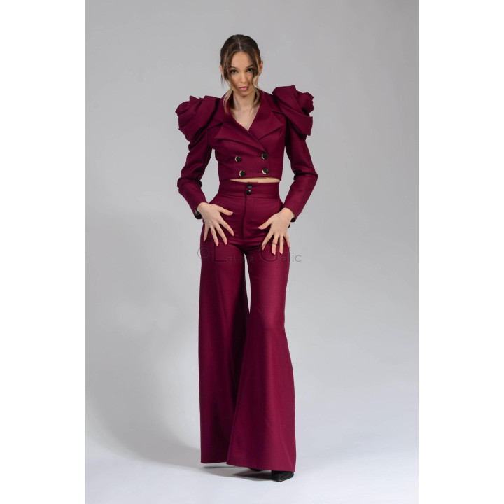 Front view of the cropped Alegria jacket with wide lapels, styled with matching trousers