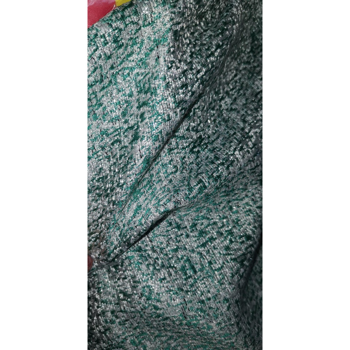 Close-up of brocade fabric with green threads and shimmering highlights, shown as a material option for Federica