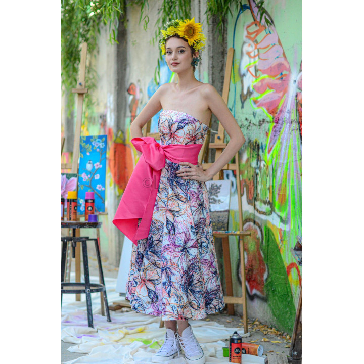 Salma 2 dress showing the fuchsia sash wrapped over the corset waist