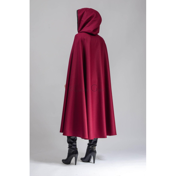 Back view of the burgundy midi cape with its hood and generous draped shape
