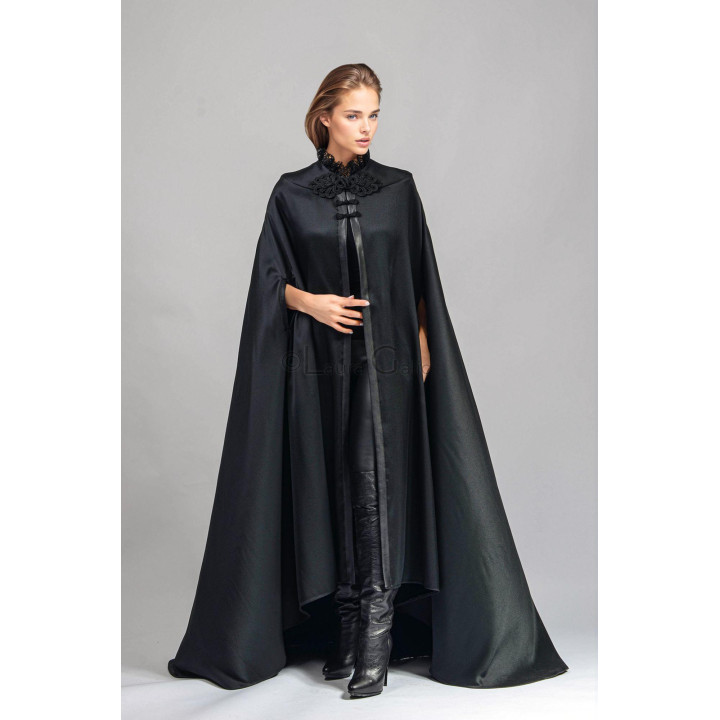 Front detail of the Maxi cape showing its high lace collar and frog buttons