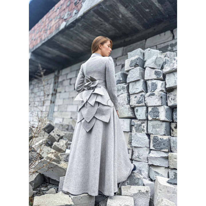 Back view of the Tamura Amaryllis coat showing its layered petal appliqué