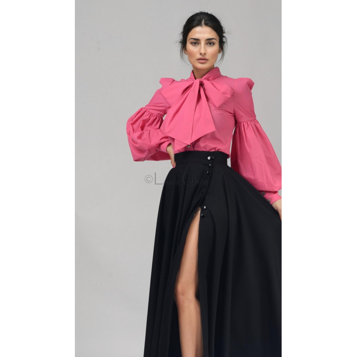 Pink Luana shirt with a wide neck tie and voluminous sleeves, styled with a black skirt