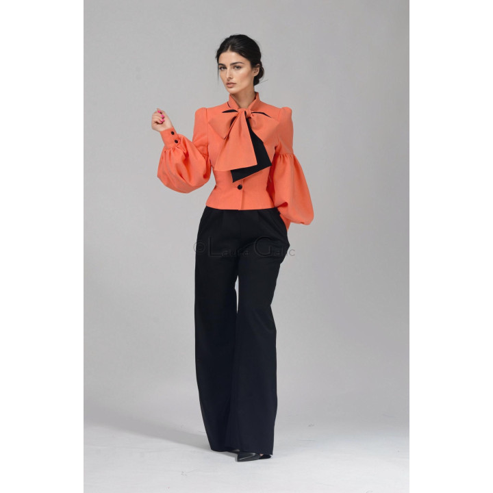 Black Charlie trousers styled with the coral Luana jacket