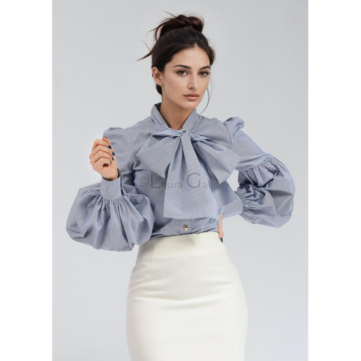 Close-up of the puff sleeves and neck bow on the Luana shirt