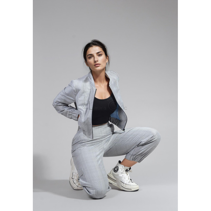 Open Smart-Cargo cropped jacket with front zip, styled with plaid cargo trousers