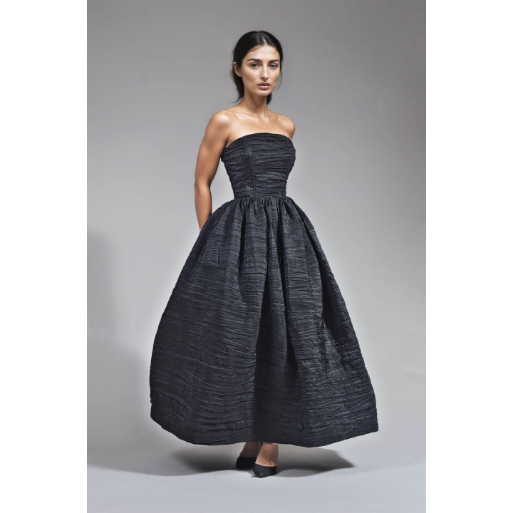 Front view of the Dalma dress showing its cotton corset and full skirt
