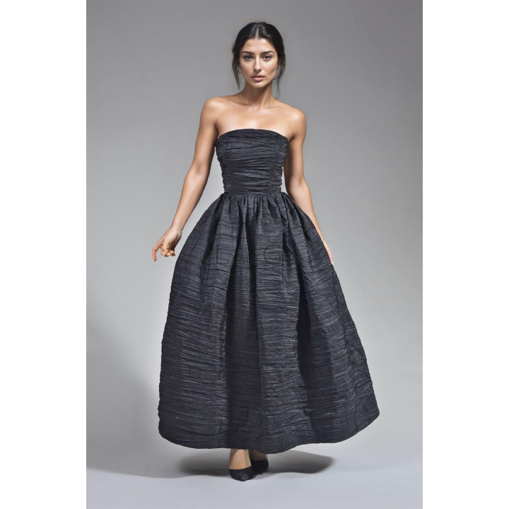 Close view of the Dalma dress's strapless corset and pleated taffeta texture