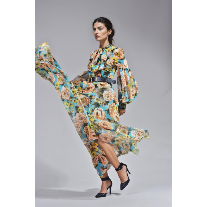 Luana floral maxi dress with a flowing skirt caught in motion