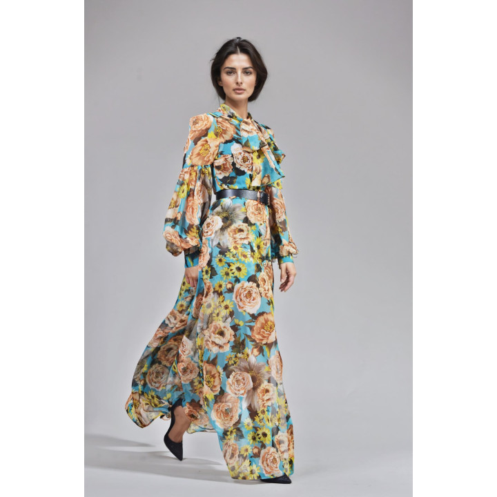 Luana floral dress with blue ground and button-front detail, worn in motion