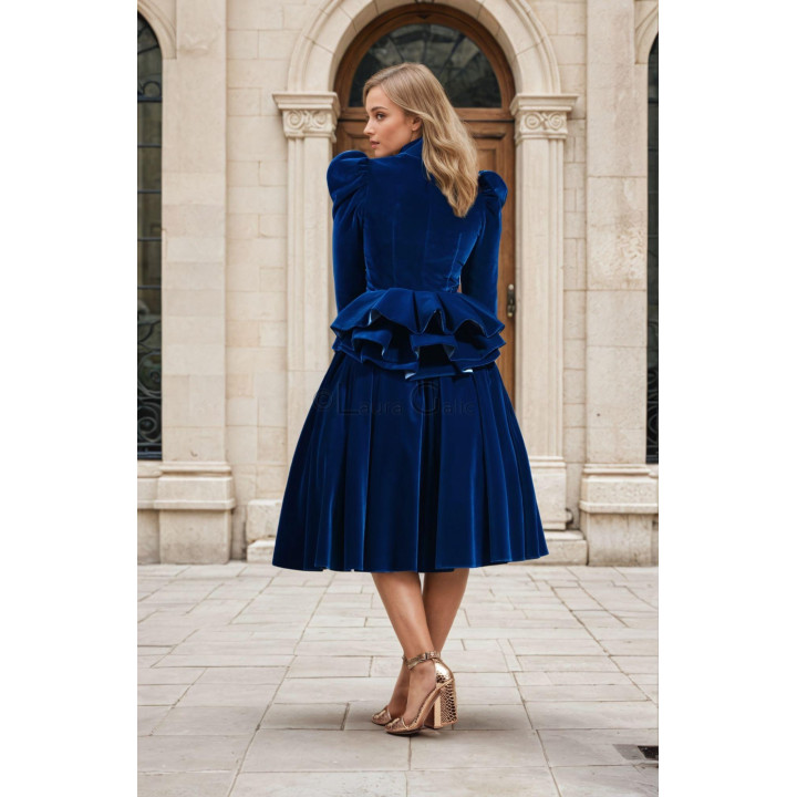 Back view of the Silvia jacket showing structured shoulders and layered peplum ruffles