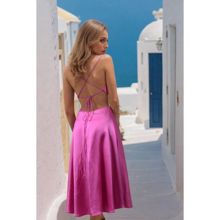 Open back of the Citra dress with crossed slim straps and tie fastening