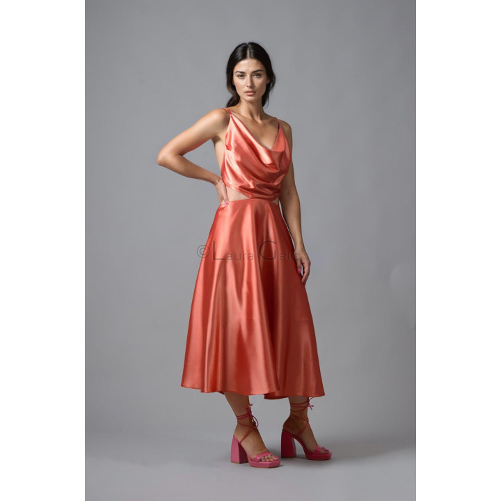 Citra dress showing its waist cut-outs and full coral satin skirt
