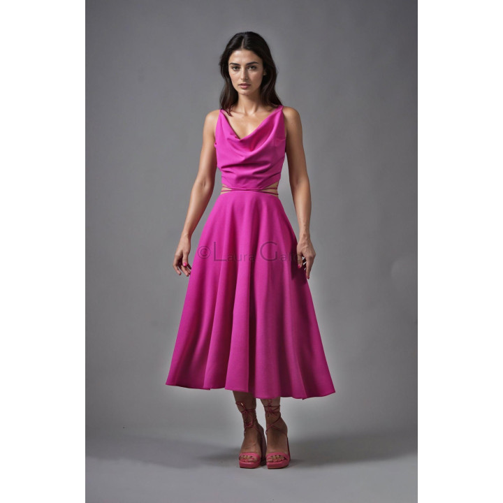 Front view of the Citra dress with a draped neckline and full fuchsia midi skirt