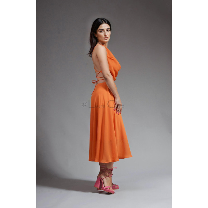 Side view of the Citra dress showing its open back and tie straps