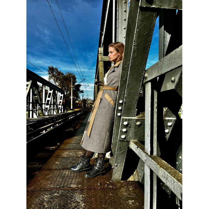 Romanita 3 coat shown from the side with a beige belt and contrasting panels