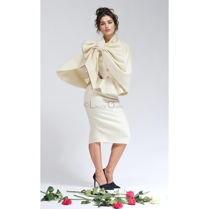 Laura Galic asymmetrical wool cape with a decorative neck fastening and flowing folds