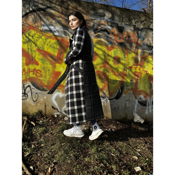 Side view of the Romanita 3 coat with a dark textured panel and belt