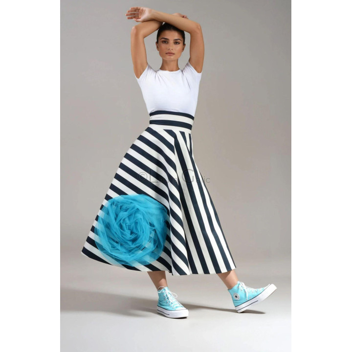 Danika midi skirt with black-and-white stripes and a turquoise tulle rose, shown in motion