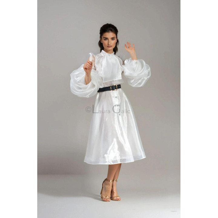 Front detail of the Luana bridal dress with a high neck, scarf and puff sleeves
