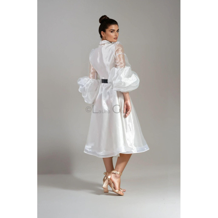 Back view of the Luana bridal dress with voluminous sleeves and a midi skirt