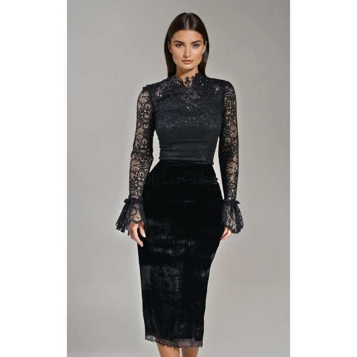 Front view of the fitted black Pandora skirt with a midi length and lace hem