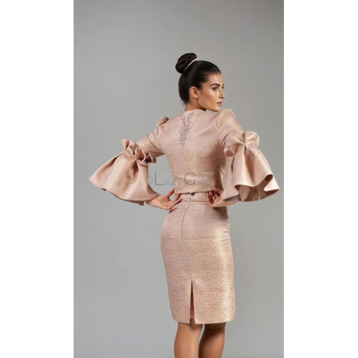 Back view of the Federica 2 peach suit, showing jacket embellishment and the skirt's back slit