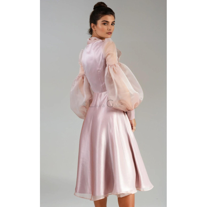 Back view of the Luana dress with billowing organza sleeves and a flared skirt